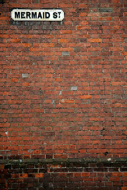 istock mermaid street brick wall background rye 104120058