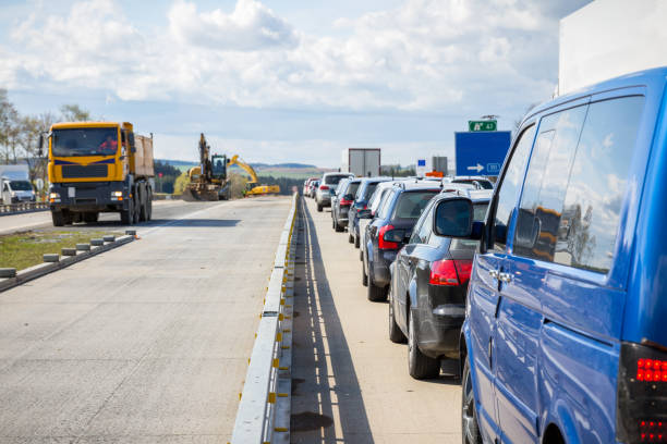 istock Cars line up on the freeway due to road construction 1041202180