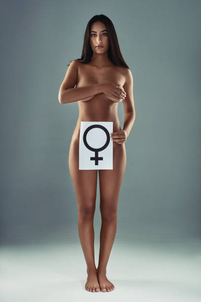i am a female, i already define femininity - placard women holding standing imagens e fotografias de stock
