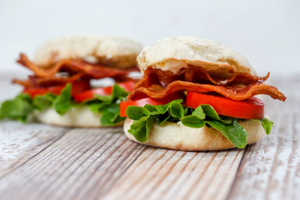 BLT Sandwich on English Muffin Bacon, lettuce and tomato sandwiches with mayonnaise on toasted English muffin. english muffin stock pictures, royalty-free photos & images