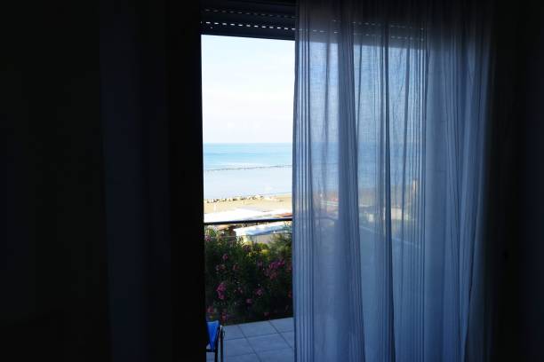istock look at the sea from the hotel window 1041213012