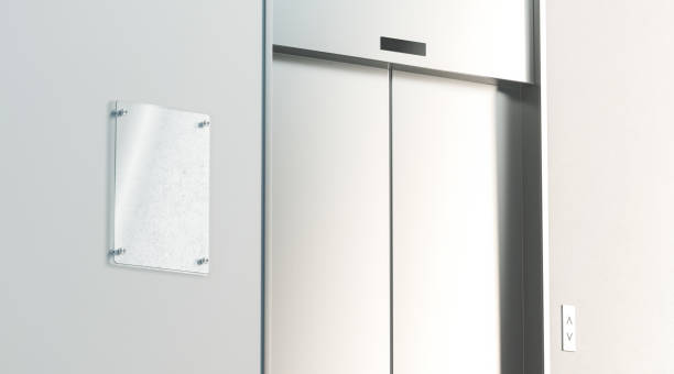 istock Blank signage near closed elevator in office floor interior mockup 1041214554