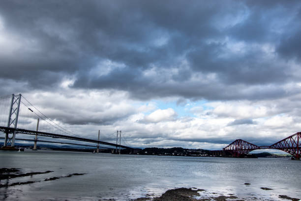 istock Panoramic view of Firth of Forth bridges (Queensferry Crossing, Forth Road Bridge and Forth Bridge) 1041214744