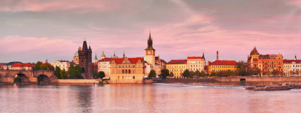 istock Prague, riverside on sunset in a pink glow 1041214824