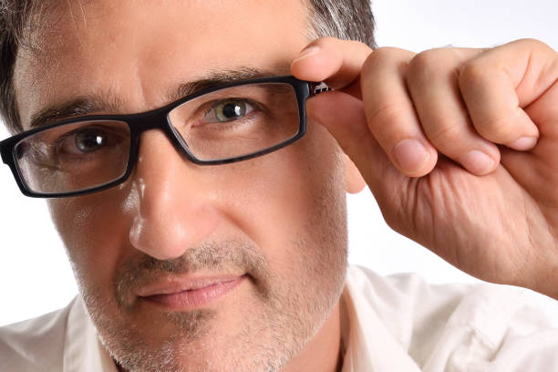 istock Attractive middle-aged man with white shirt adjusting the glasses 1041215084