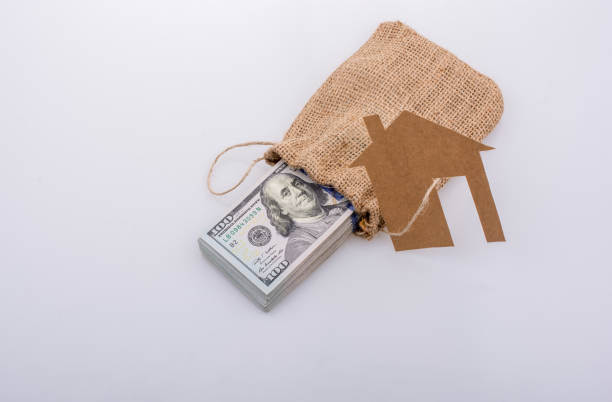 istock Paper house beside US dollar banknote 1041225180
