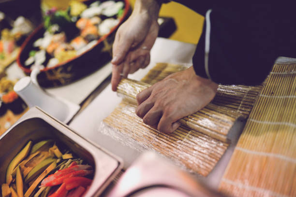 istock Close-Up Of Man Preparing Sushi 1041228700