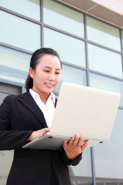 istock Asian businesswoman using laptop 1041228964
