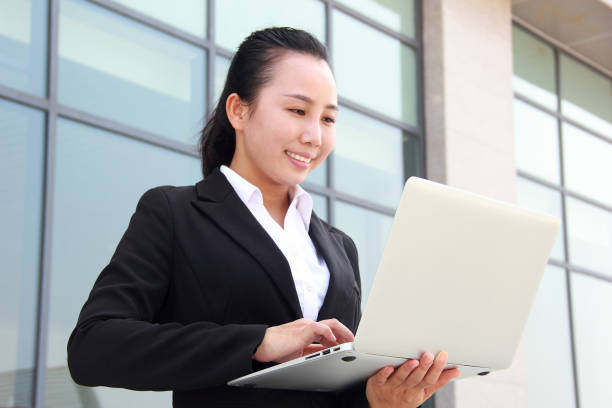 istock Asian businesswoman using laptop 1041229652