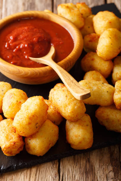 istock Fried Tater Tots with tomato sauce close up. vertical 1041236740