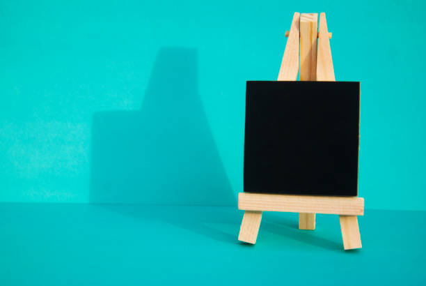 istock Mini blackboard chalkboard with copy space, isolated on blue background. 1041238362