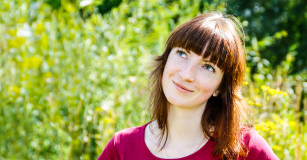 istock Young Woman on Summer Field 1041242978