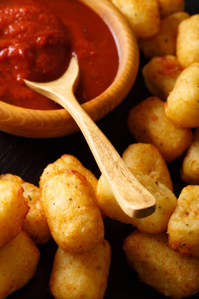 istock American Food: Tater Tots and ketchup close-up. vertical 1041243332