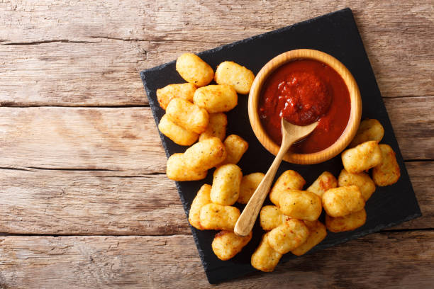 istock Deep-fried Potato Tater Tots and ketchup close-up. horizontal top view 1041246026