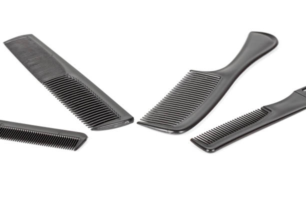 istock hair tools, beauty and hairdressing concept - different combs on white background 1041251164