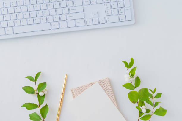 istock Flat lay desk and branch with green leaves 1041252114