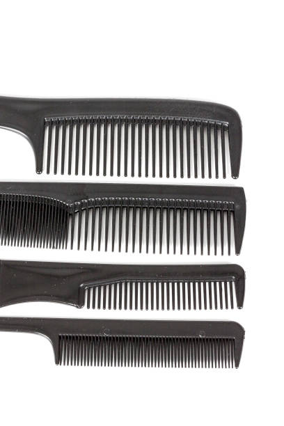 istock hair tools, beauty and hairdressing concept - different combs on white background 1041258674