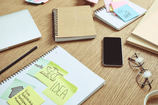 istock note papers with business strategy and smartphone with blank screen on table at home 1041260602