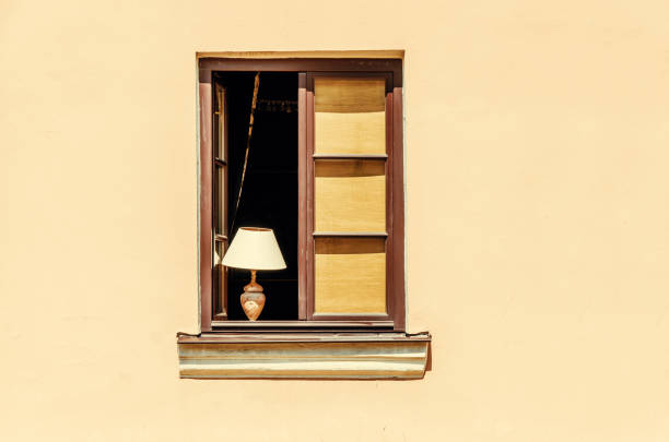 Brown window in the old house, open, table lamp