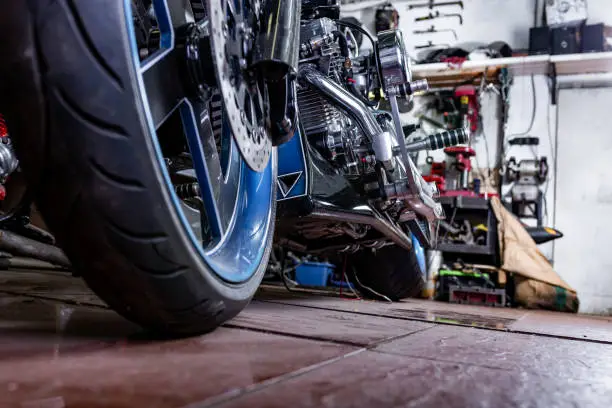 Detail on a modern motorcycle in the workshope. Motorcycle Exhaust. selective focus. Closed up and selected focused of big motorcycle engine and other details.