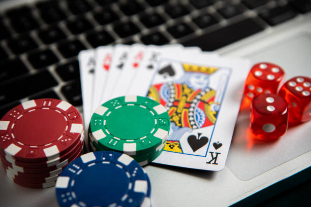 Poker chips and cards on computer keyboard Poker chips and cards on computer keyboard texas hold em photos stock pictures, royalty-free photos & images