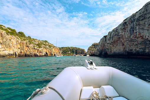 Barco velero en Cala Coves, Menorca, Islas Baleares, España photo