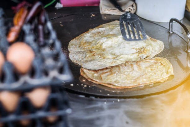 Roti in the market Roti in the market roti canai stock pictures, royalty-free photos & images