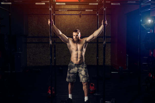 istock Strong focused sporty bodybuilder working out in gym. 1041298912