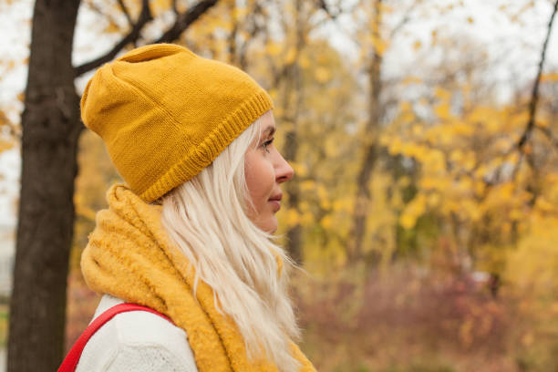 istock Beautiful young woman outdoors walking in fall park 1041305770