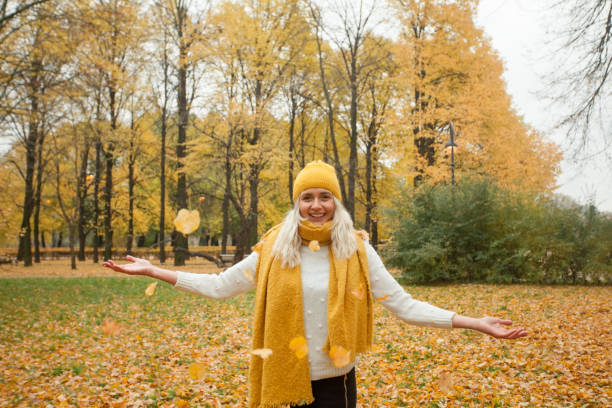 istock Beautiful woman outdoors on autumn background 1041305846