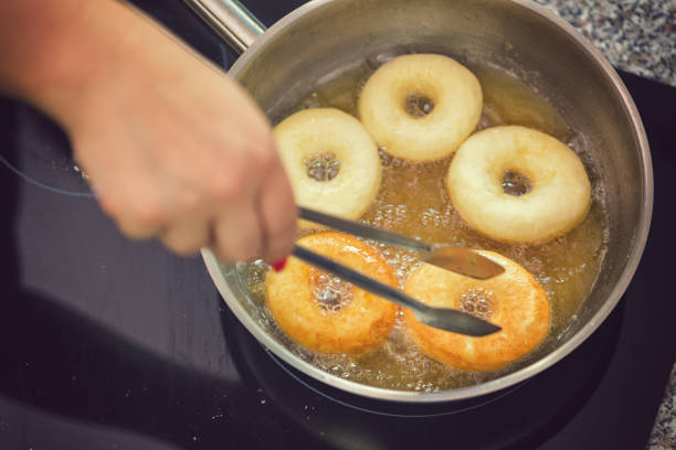 istock Woman Preparing Donuts at Home 1041310326