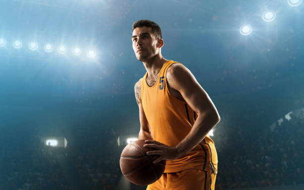 istock Basketball player holding a ball before a shot 1041324388