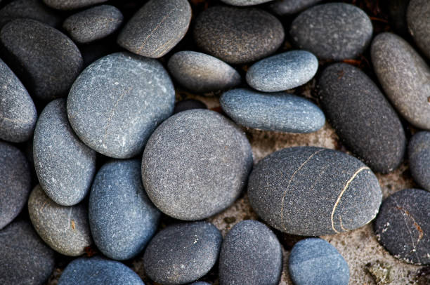 A Close-Up Shot of Smooth, Rounded, Blue Stones for a Horizontal Background stock photo