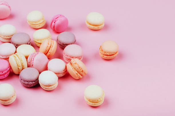 istock Different types of macaroons on pink background. 1041334596