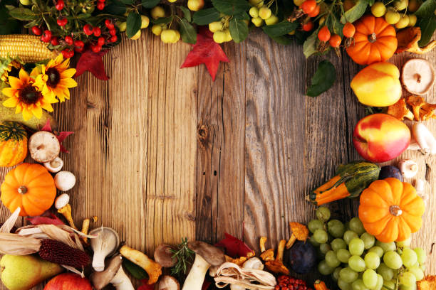 istock Autumn nature concept. Fall fruit and vegetables on wood. Thanksgiving dinner 1041334676