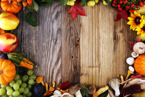 istock Autumn nature concept. Fall fruit and vegetables on wood. Thanksgiving dinner 1041335112
