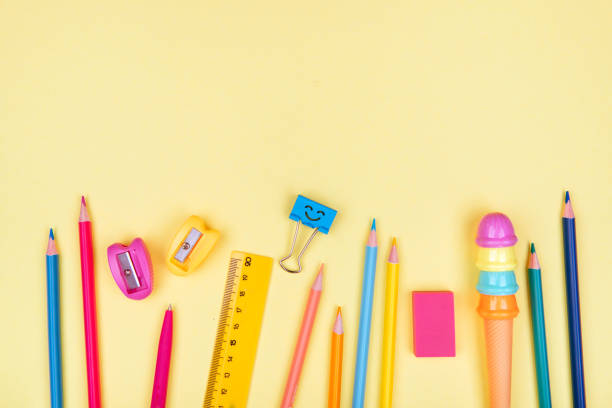 istock School accessories on a yellow background. 1041338820