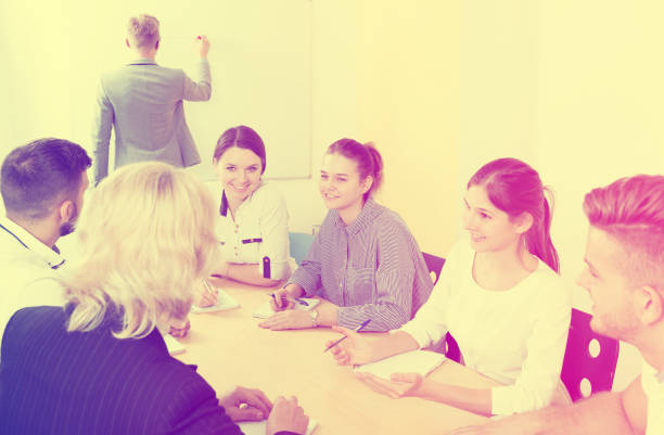 istock positive students working together in auditorium 1041339928