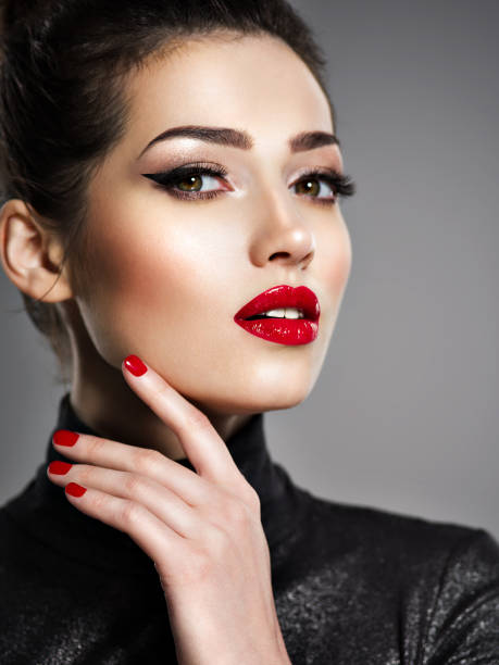istock Beautiful woman with bright make-up and red nails. 1041340798
