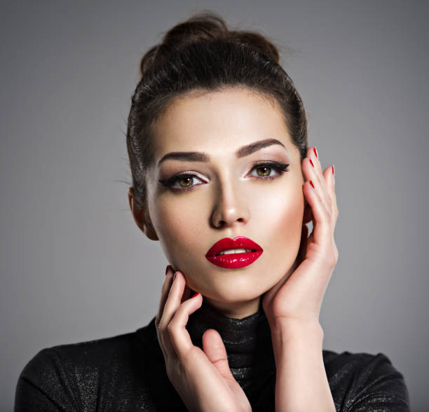 istock Beautiful woman with bright make-up and red nails. 1041340834