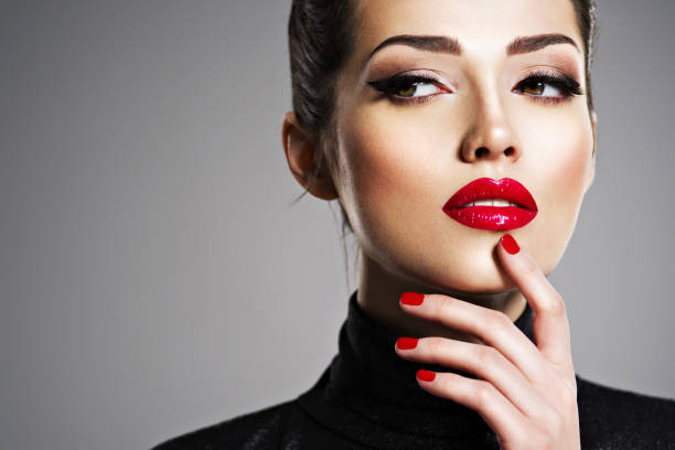 istock Beautiful woman with bright make-up and red nails. 1041340918