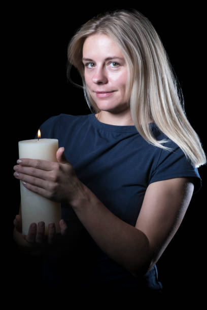 istock Woman with a candle at night 1041346866