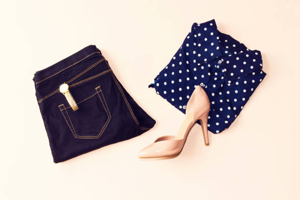 istock blue blouse and blue jeans, hand watch, pink heels. Women's spring summer basic outfit. Apparels flat composition 1041360500