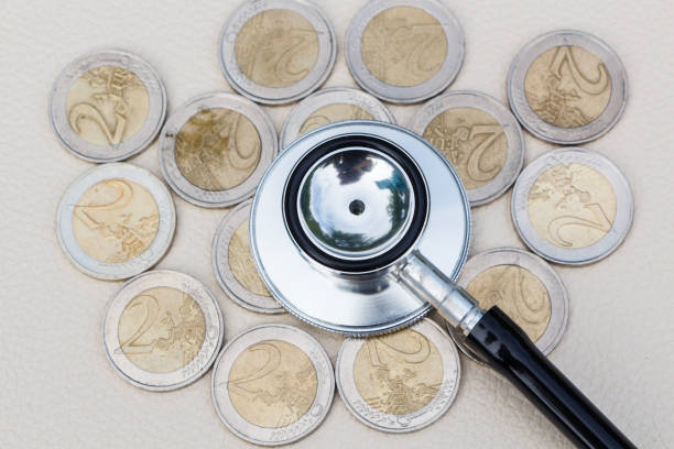Black stethoscope on coins of two euros