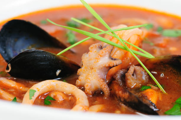 istock Seafood Soup in white dish closeup 1041368186