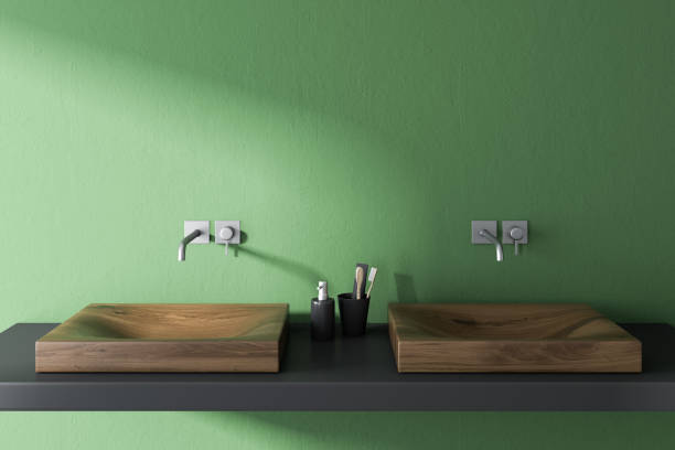 istock Wooden double sink in green bathroom 1041368630