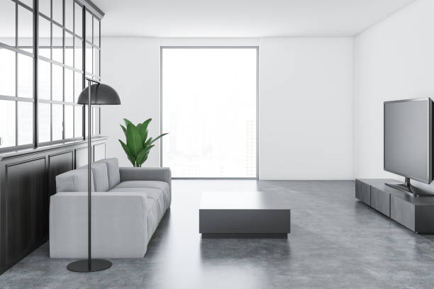 istock White living room, white sofa, TV set 1041373178