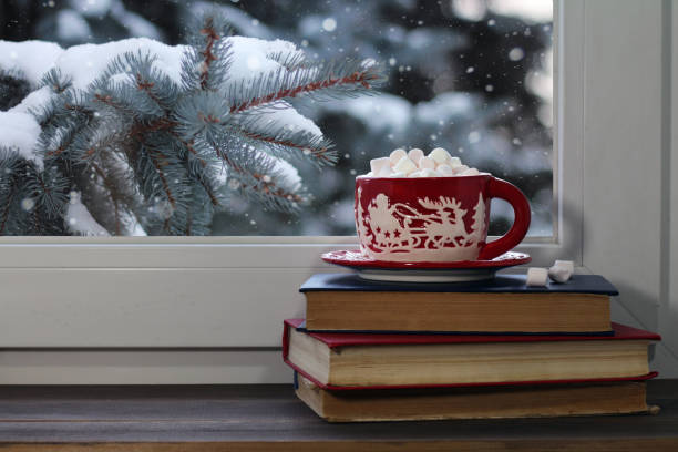 istock Red Christmas mug on a window sill 1041373306