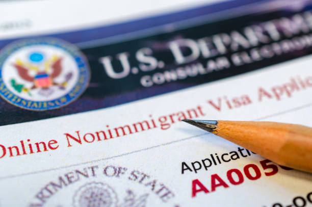 USA visa application Online non-immigration visa application form with a pencil hazard sign photos stock pictures, royalty-free photos & images