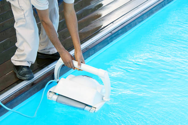istock Hotel staff worker cleaning the pool 1041384678